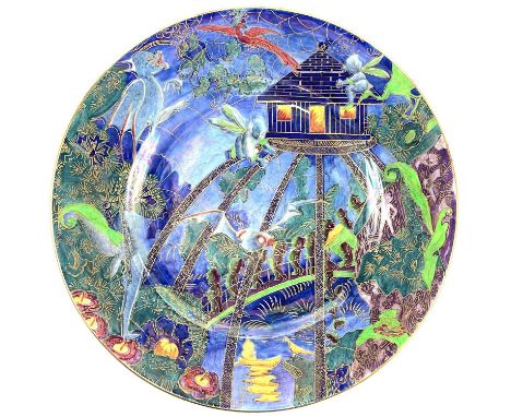 A Wedgwood fairyland lustre plate. Roc centre Imps on a bridge, and tree house pattern, gilt Portland vase mark, diameter 27.