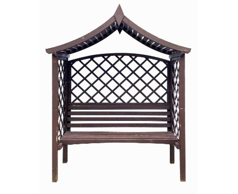 A three-seater arbour bench. With trellis sides, height 226cm width 176cm depth 93cm.