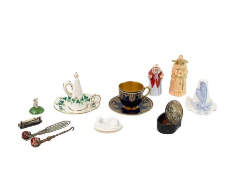 A Royal Worcester China Works candle snuffer, In the form of a Tyrolean hat with blue ribbon and feather, height 6.5cm, toget