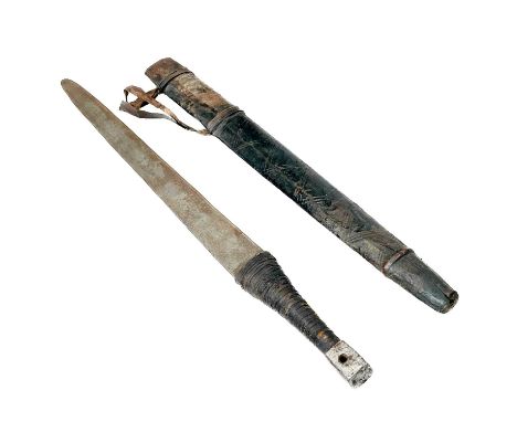 An Omani sword and scabbard. The 66cm fullered blade with etched signature or inscription, bound leather grip, and iron pomme