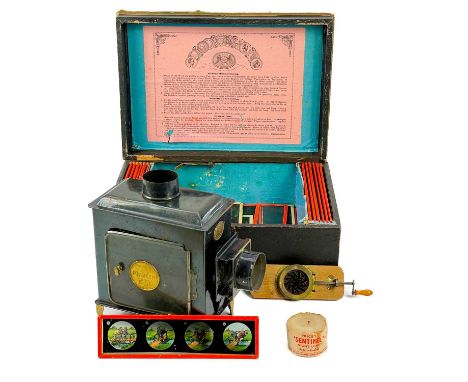 The Standard Magic Lantern. With slides including a glass kaleidoscope slide in original box.
