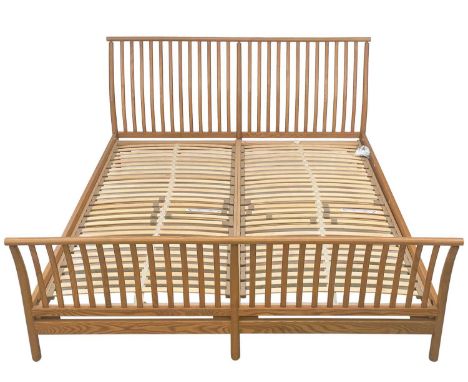 An Ercol light elm super king size bed. With Ercol button label.There is general/light wear throughout. Outer dimensions heig