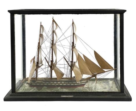 A scratch built model of the H.M.S Rodney. Under ebonized glass case, overall height 33cm width 46cm depth 23cm.