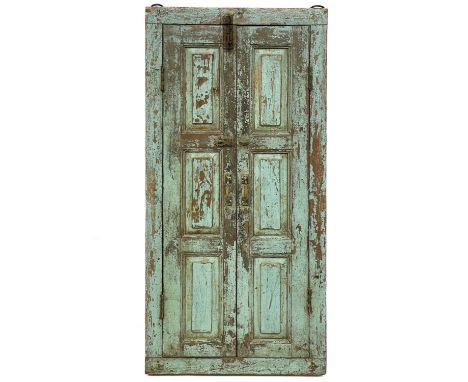 An Indian Himalayan style mirror. With painted panel double doors and iron rings, height 123cm width 58cm