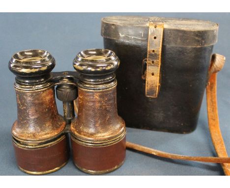 Pair of military binoculars in leather case marked 1915 10 Lincoln with broad arrow mark (missing central pin) marked in pen 