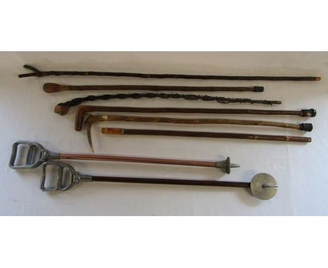 Pair of Featherwate shooting sticks and assortment of walking sticks including horn handled, thumb stick etc