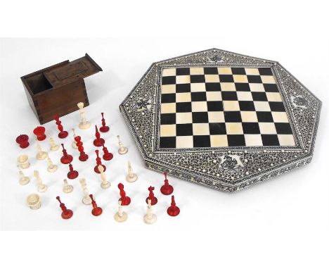 A late 19th century Anglo-Indian ivory games board and chess set.  Condition Report There are four losses to the decorative b