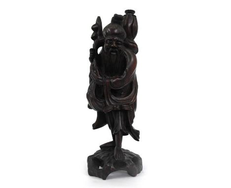 A rootwood figural table lamp in the form of a robed man 44cm high 