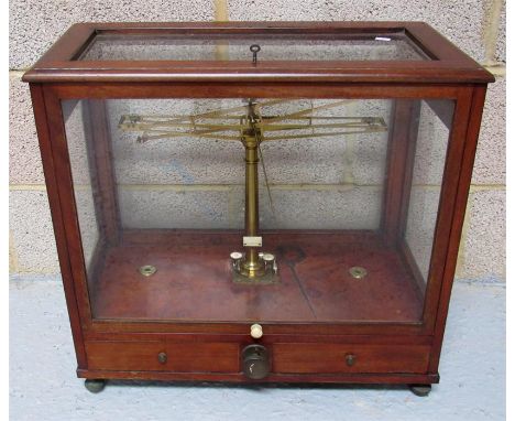 A set of mahogany cased brass laboratory scales 58cm wide 