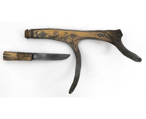  An Inuit antler dagger and scabbard, decorated reindeer 36 cm long