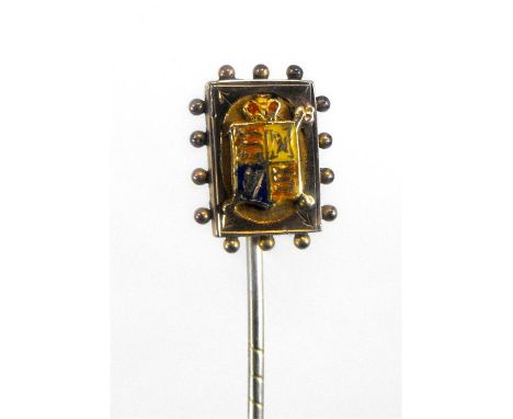 A Victorian 9 carat gold and enamel stick pin, decorated with a royal crest, 6.5cm high 