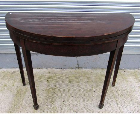 A 19thC demi loon mahogany card table with square tapering legs 99cm wide 