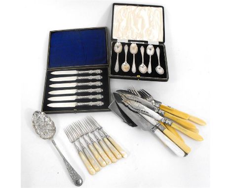 A cased set of silver teaspoons, Sheffield 1912, a cased set of silver handled cake knives, seven silver and mother of pearl 