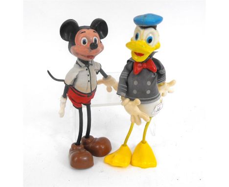 A Marx Toys Walt Disney figure of Mickey Mouse and another similar, Donald Duck, 15cms high (2). 