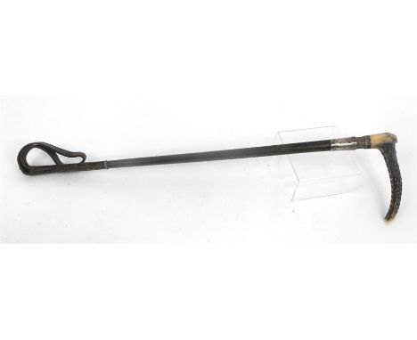 A late 19th / early 20th century rhino horn riding crop with antler handle and white metal collar engraved Capt. A. Regan  4/