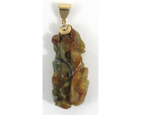 A Chinese jade pendant carved with entwined panthers mounted with a yellow metal loop set with a single diamond 5cm high 