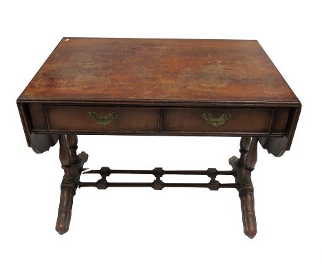 A figured mahogany sofa table with two short and two false drawers on turned twin supports 95cm wide 