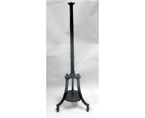 A mahogany standard lamp, with turned column on tripod base 
