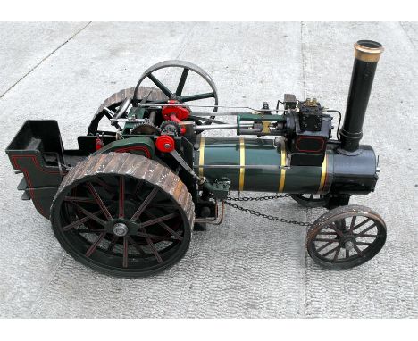 A three inch scale live steam model of a Burrell & Sons traction engine, finished in green and black paintwork with associate