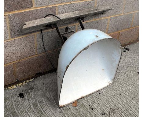 A large industrial, enamel outside light 