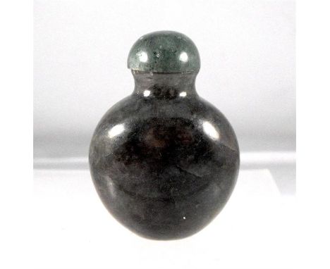 A 19th century Chinese mottled green jade snuff bottle, 5.5cm high. 