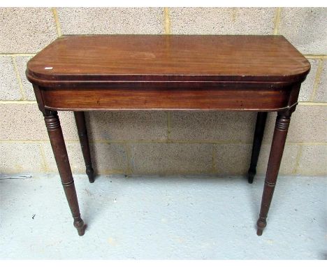 A 19th century mahogany card table on ring turned legs (AF) 92cm wide 