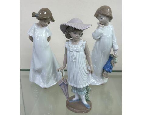 Three NAO by Lladro figurines to include ' April Showers', ' My Rag Doll', etc