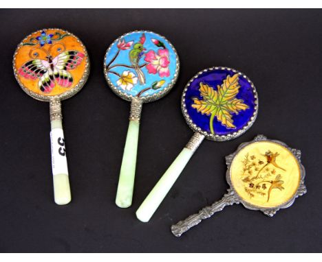 Three Chinese jade handled white metal and enamel hand mirrors, L. 15cm. with a further hand mirror. Jean rich collection. Je