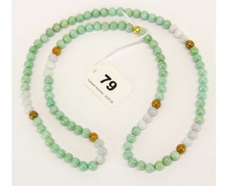A single strand necklace of mixed colour jade beads, necklace L. 78cm.
