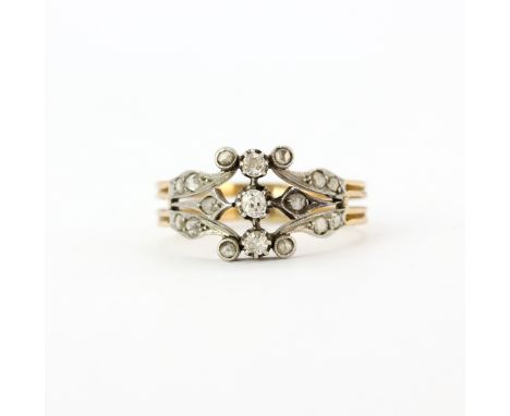 An antique yellow metal (tested minimum 9ct gold) ring set with diamonds and rose cut diamond shoulders, (R.5).