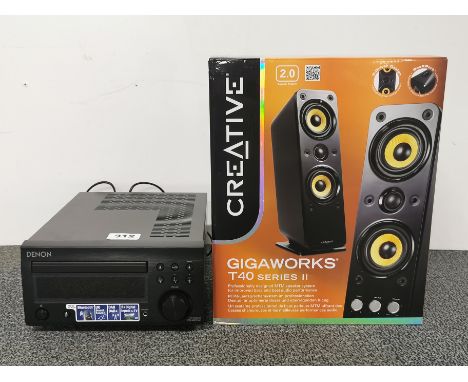A Denon CD reciever (RCD-m41DAB), together with a Creative Gigaworks T40 Series II 2.0 speaker system (OB PN 06MF161500004 Re
