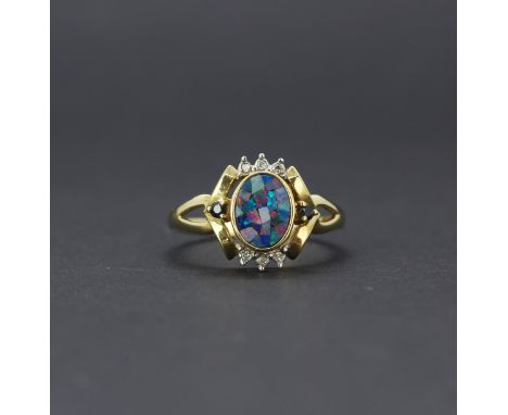 A hallmarked 9ct yellow gold triple opal mosaic ring set with diamonds and sapphires, (P).