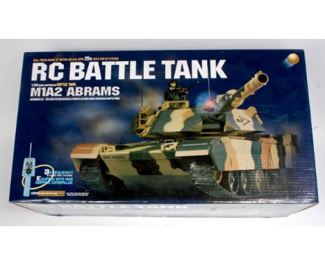 A boxed Remote Control 1/24th scale Battle Tank, has been used but appears complete, in the original polystyrene tray box