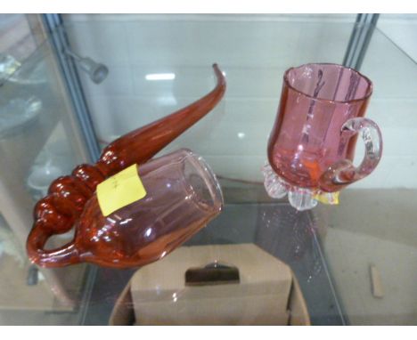 A cranberry glass pipe and jug