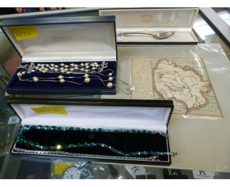 A silver spoon, an antique map,  a Murano necklace and one other, and a necklace and a bracelet set