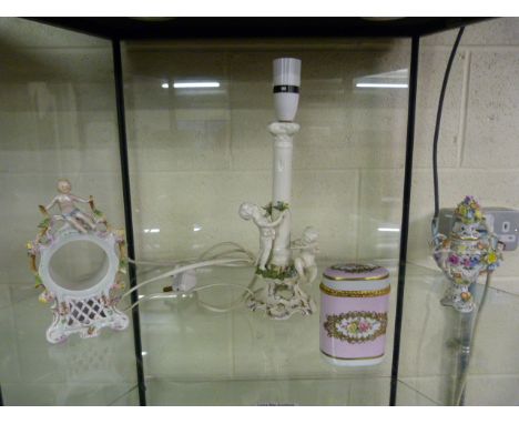 Lamp decorated with cherubs, a clock and two pots
