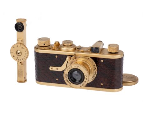 A Leica Model Ia 'Luxus' Replica Camera, 1930, gold, serial no. 36221, with Leitz Elmar f/3.5 50mm lens, gold, body, VG-E, sh