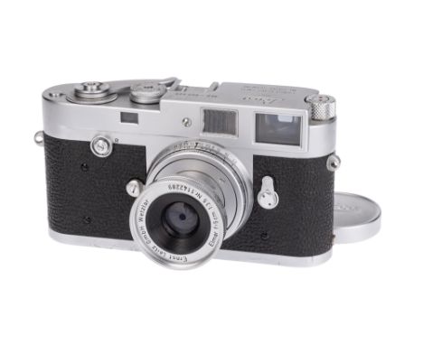 A Leica M2 Rangefinder Camera, 1959, chrome, serial no. 960928, no self-timer, button rewind, with Leitz Elmar f/3.5 50mm len