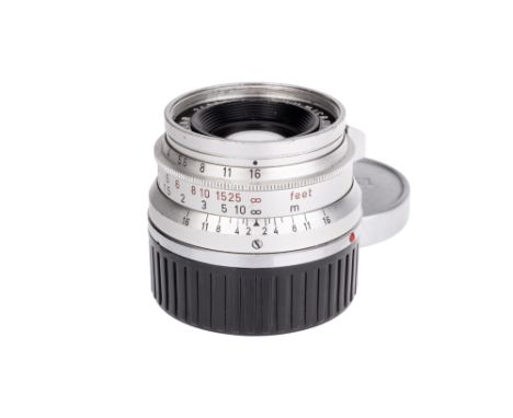 A Leitz Summicron f/2 35mm Lens, chrome, serial no. 2133785, body, F, elements, F-G, some fungal marks to center of middle gr