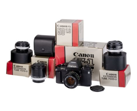 A Canon F-1 New SLR Camera, 1981, black, serial no. 300461, with Canon FD f/1.8 50mm lens, black, serial no. 8068929, body, V