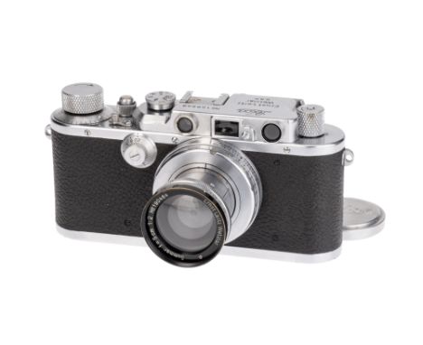 A Leica III Rangefinder Camera, 1934, bright chrome, serial no. 128998, with Leitz Summar 'black rim' f/2 50mm lens, chrome, 