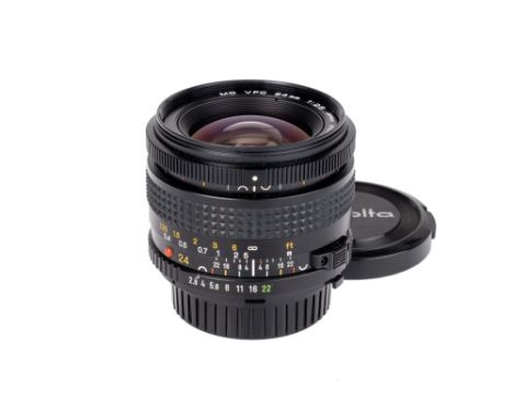 A Minolta MD VFC f/2.8 24mm Lens, black, serial no. 8001709, body, VG-E, elements, VG, some internal haze, complete with make