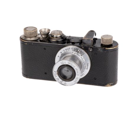 A Leica Ic Camera, 1931, black, serial no. 61685, with Leitz Elmar f/3.5 50mm lens, chrome, serial no. 432718, body, F-G, shu