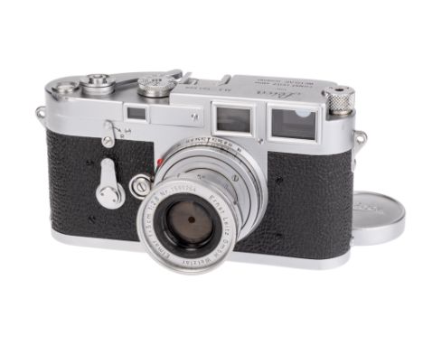 A Leica M3 DS Rangefinder Camera, 1954, chrome, serial no. 701509, with Leitz Elmar f/2.8 50mm lens, chrome, serial no. 15902