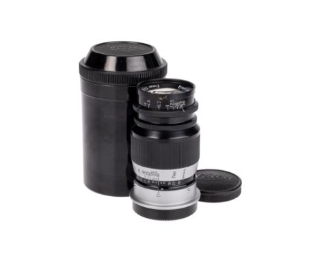 A Leitz Elmar f/4 90mm Lens, black/chrome, serial no. 221038, body, E, elements, VG-E, complete with lens caps and maker's ha