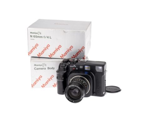 A Mamiya 7II Medium Format Rangerfinder Camera, 1999, black, serial no. CC1099, with Mamiya N L f/4 65mm lens, black, serial 