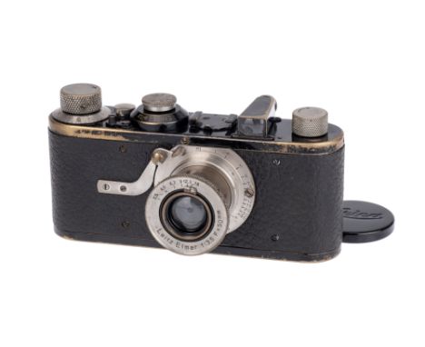 A Leica Ia '4-digit' Close Focus Camera, 1926, black, serial no. 1817, with Leitz Elmar f/3.5 50mm lens, body, G, shutter fir