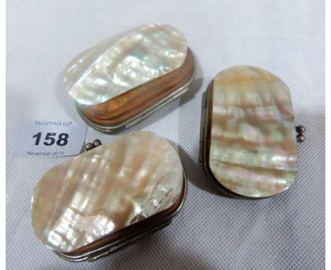 Three mother-of-pearl, white metal and leather lined purses. Undecorated. 2¾'' wide. One nacre shell panel detached