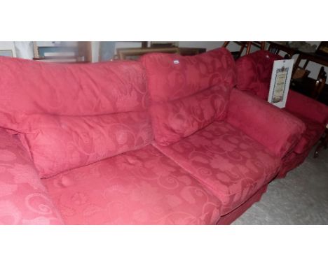 A loose covered sofa and armchair