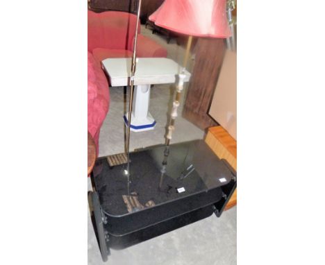 Two lamp standards and a TV stand
